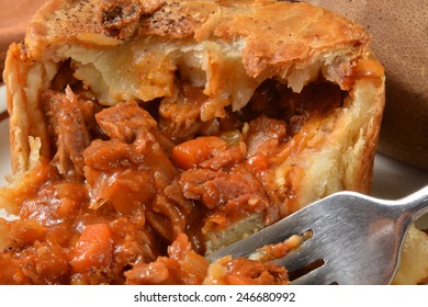 Close Up Of A Steak Pot Pie With Carrots, Mushrooms, Potatoes And A Ale Gravy