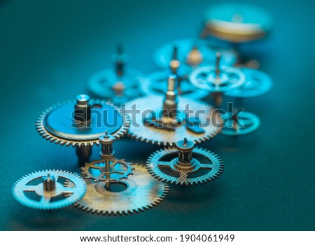 Close up of Steampunk Clock Cogs on blue background