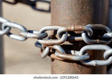 Close up Steel Gate Chain around Rusted Pipe