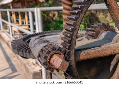 Close up of Steel gears on the floodgate used for control the flow of water. Metal mechanical gear on the floodgate for open or close the dam gate.