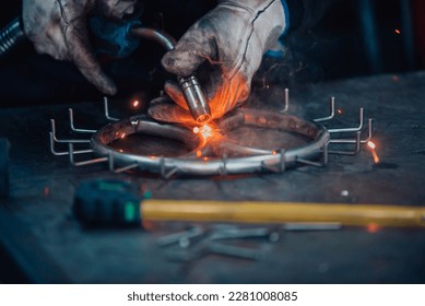 Close up of the steel welding process. Work in the heavy steel industry