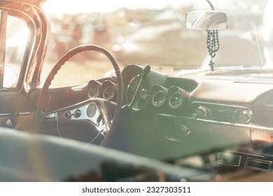 Close up of the steering wheel and dashboard of a vintage car. - Powered by Shutterstock