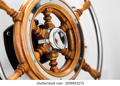 Close Up Of Steering Wheel Made Of Wood On A Boat.