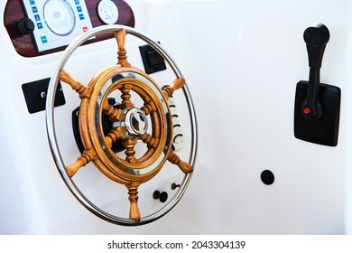 Close Up Of Steering Wheel Made Of Wood On A Boat.