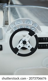 Close Up Of Steering Wheel Made Of Wood On A Boat.