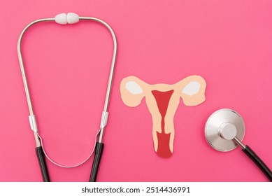 close up of Stethoscope with Paper Cutout Uterus on Vibrant Pink Background - Women's Healthcare and Medical Exam Concept - Powered by Shutterstock