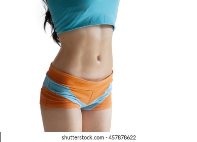 Close up of stomach of healthy woman wearing sportswear in the studio, isolated on white background