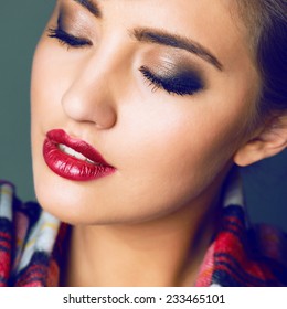 Close Up Studio Fashion Portrait Of Beautiful Sensual Woman With Full Berry Sexy Lips And Smoky Make Up. Toned Bright Colors.