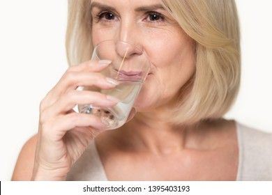 Close Up Studio Image Attractive Healthy Aged Woman Holding Glass Drinking Enough Still Water, Prevention Dehydration In Older Adults, Healthy Habit Lifestyle, Helps Digestion, Health Benefits Concept