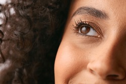 Close Up Studio Portrait Showing Eye Of Smiling Natural Woman