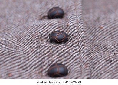Close up studs on brown wool texture