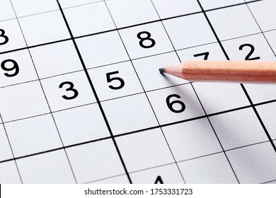 Close Up Sudoku Puzzle Game And Pencil. Leisure Time Exercise For Brain Health Against Alzheimer Disease.