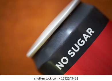 Close Up Of Sugar Free Drinking Cans. Metal Container Of Carbonated Soft Drink, Alcoholic, Fruit Juices, Teas, And Energy Drinks. Tin Can On Wooden Backgroud.