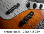 Close Up of Sunburst Bass Guitar Strings and Bridge