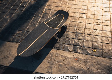 Close Up Surf Skate Or Skateboard At Park Sunset