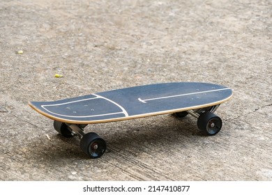 Close Up Surf Skate Or Skateboard At Park Sunset