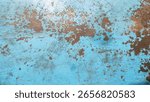 Close up surface of aged and weathered rusty metal surfaces in high resolution. Faded blue paint background with rust