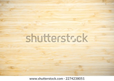 Close up to surface of Wooden Cutting board in kitchen for any ingredient food background.
