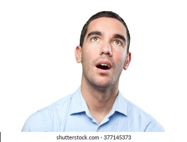 Close Up Of A Surprised Young Man Looking Up