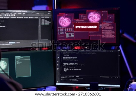 Close up of system hacked message on PC in empty underground lair used by hacker to steal data. Malicious software on computer targeting unpatched security systems, compromising digital devices