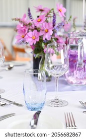 Close Up Of Table Place Setting At Formal Dinner With Empty Wine Glasses