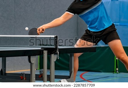 close up of table tennis player returning the ball