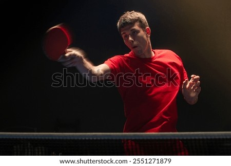 Close up of a table tennis player returning the ball