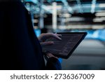 Close up of tablet used by data center computer scientist to write code, updating infrastructure network systems. Server hub worker typing on touchscreen device, coding upgrades