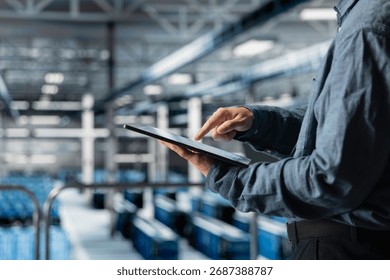 Close up of tablet used by data center technician to manage software updates for system stability. Server room IT expert optimizing performance with device, configuring infrastructure