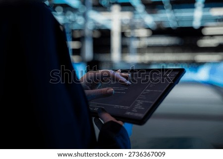 Close up of tablet used by data center computer scientist to write code, updating infrastructure network systems. Server hub worker typing on touchscreen device, coding upgrades