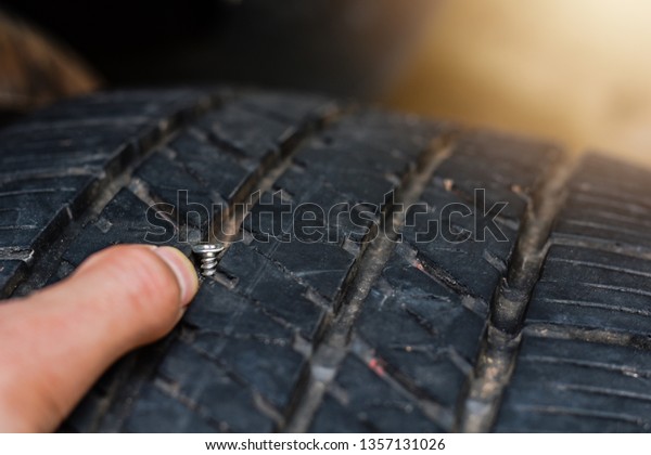 Close up tack in tire ,Flat tire The
tire is leaking from the nail Can a Tire be
Repaired