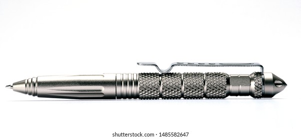 Close Up Of A Tactical Pen Isolated In White Background