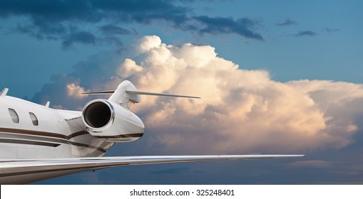 Close Tail Side View Of A Private Jet Flying