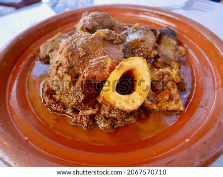 Close up of Tangia, Tanjia, a local dish from Marrakech and meat lovers' dream. Roasted lamb cooked in clay pots at Hammam furnace. Marrakech, Morocco.