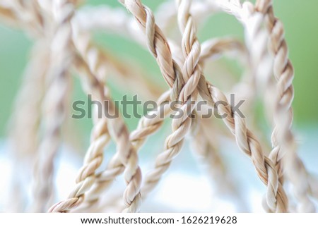 Close up Tangled Strings on Green Background. The crossroads of life image.