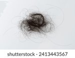 Close up of tangled woman hair on white studio background