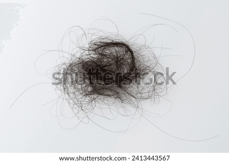 Close up of tangled woman hair on white studio background