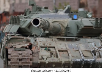 Close Up Of Tank Gun Muzzle. War In Ukraine. Burned Tank.