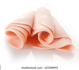 Close Up Tasty German Folded Bologna Sausage Thin Slices Isolated On White Background.