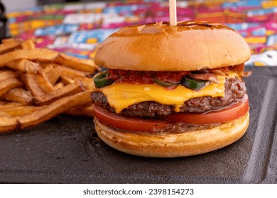 Close up of tasty spicy burger with fries - Powered by Shutterstock