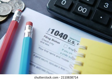 Close up of a Tax return form and pen on table. - Shutterstock ID 2110838714