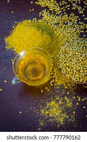 Close Up Of Tea Of Coriander,Coriandrum Sativum
 With Powder On A Wooden Surface.