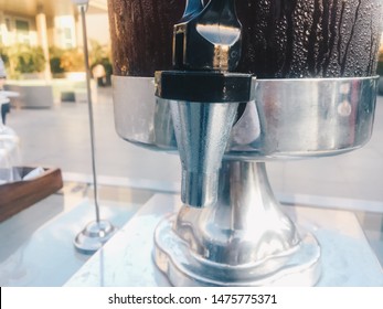 Close Up Of Tea In The Water Dispenser Or Pitcher Or Gallon With Water Drops.