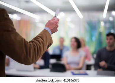 close up of teacher hand with marker while teaching lessons in school  classroom to students - Shutterstock ID 410166373
