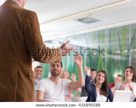 close up of teacher hand with marker while teaching lessons in school  classroom to students