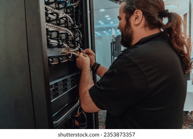 Close up of technician setting up network in server room 