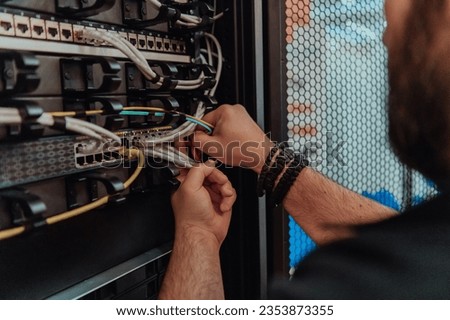 Close up of technician setting up network in server room 