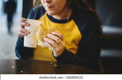 Close Up Of Teenage Girl Eating Hamburger Obesity Concept