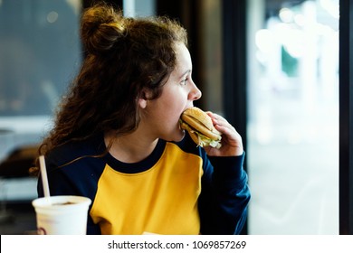 Close Up Of Teenage Girl Eating Hamburger Obesity Concept