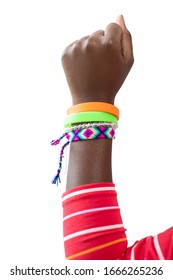 Close Up Of Teenage Girl Wearing Wristbands Raising Arm In Air To Depict Empowerment